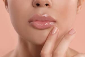 Close-up of natural lips showing smooth texture, subtle shine, and balanced shape for facial harmony