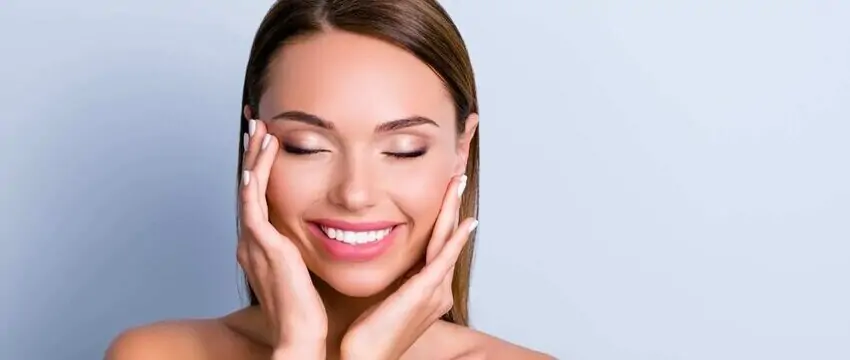 Woman with smooth, youthful skin after dermal filler treatment, highlighting natural facial rejuvenation, restored volume, and enhanced facial contours.